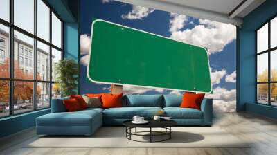 Blank Green Road Sign Over Clouds Wall mural