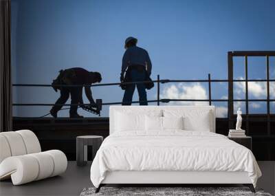 construction workers silhouette on roof Wall mural