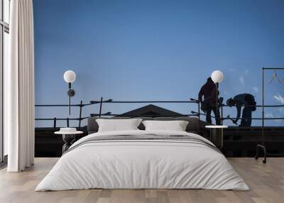 construction workers silhouette on roof Wall mural