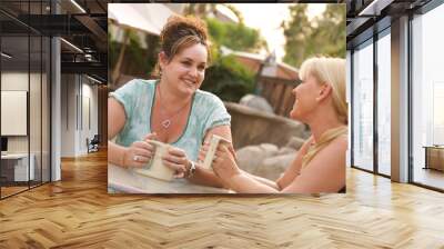 girlfriends enjoy a conversation Wall mural