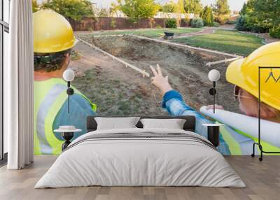 Male and Female Workers Overlooking Pool Construction Site Wall mural