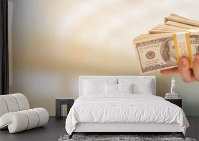 Male Hand Holding Stack of Cash Wide Banner With Room For Copy. Wall mural