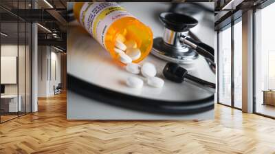 non-proprietary medicine prescription bottle and spilled pills abstract with stethoscope. Wall mural