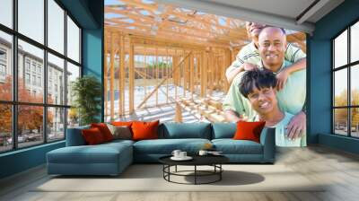 Young African American Family On Site Inside Their New Home Construction Framing. Wall mural