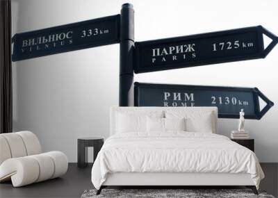 black pole with nameplates with arrow pointers with inscriptions of vilnius, paris, rome in russian  Wall mural