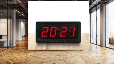 numbers 2021 on digital alarm clock face on wooden table isolated on white background Wall mural