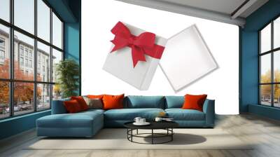 open empty grey gift box with red ribbon bow wrapped around lid isolated on white background, cardboard box wrapped with luxury gray paper and simple tied bow for put presents, flat lay top view Wall mural