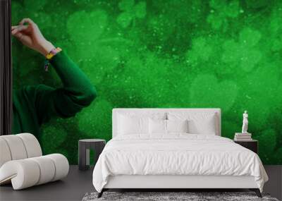 Banner with St. Patrick's Day leprechaun model girl on green magic background with shamrock leaves. Wall mural