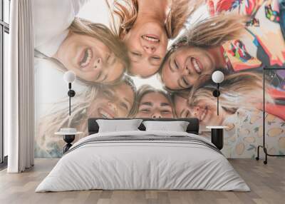 Teenage school friends smiling to camera. Diverse group of sporty attractive girls enjoy time together, smiling people in sportswear, happy friends looking at camera. Well being, wellness concept Wall mural