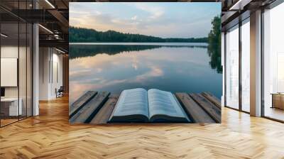 an open book of poetry on a wooden dock overlooking a serene lake, with reflections of the sky and trees on the water's surface Wall mural