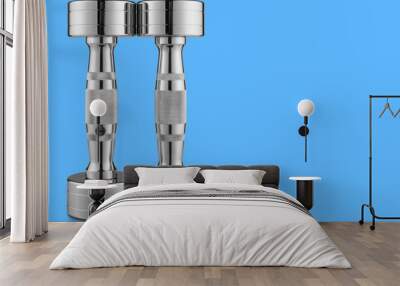 a pair of steel chrome dumbbells stands, on a blue background, concept Wall mural