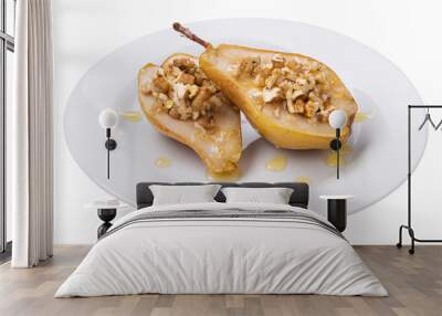 baked pear with honey and nuts, delicious dessert on a plate, on a white background Wall mural