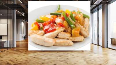 chicken pieces fried with vegetables on a plate, with ketchup, white background Wall mural