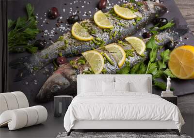 two seabass fish in marinade with spices and lemon, raw fish Wall mural