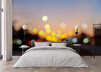 bokeh street light of traveling cars in the evening sunset. Wall mural