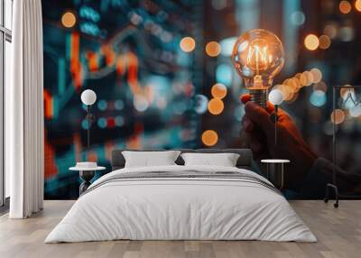 Futuristic graphic icon of glowing light bulb in hand with trading graph chart background. Strategy business planning ideas concept. Wall mural