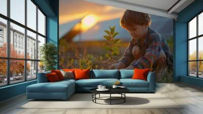 power plant technology concept picture of a kid growing a tree beside solar panels farm system. Wall mural