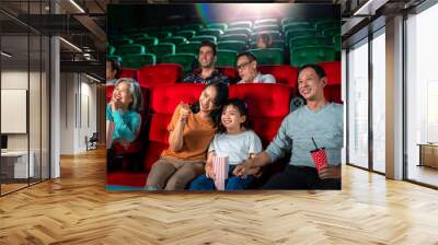 Happy group of asian family and grandmother relax and go to Cimema in movie theater Wall mural