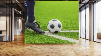 soccer ball with his feet Wall mural