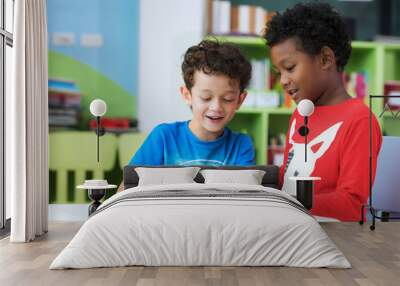 student in international preschool reading a magazine book together Wall mural