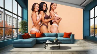 Happy portrait, lingerie and group of women in studio isolated on a brown background mockup space. Smile, underwear and model in natural beauty, self love and body positivity, health and wellness Wall mural