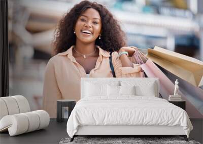 Black woman, retail shopping bag and city customer buying sales, luxury fashion product and market discount from mall store in San Francisco California. Portrait, happy and wealthy consumer in street Wall mural