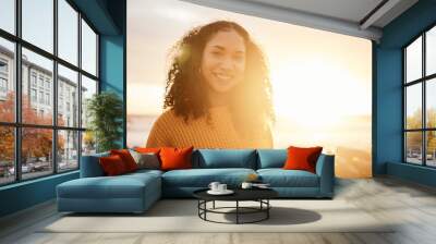 Travel, sunset and portrait of a woman at the beach while on a zen vacation or weekend trip. Happy, smile and calm female from Puerto Rico by the ocean while on a seaside holiday or adventure. Wall mural