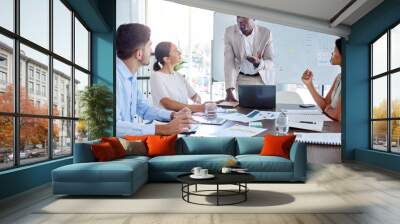 Businessman leadership speaking to employee for coaching, mentorship and economy planning in corporate company, office and discussion. Black man financial conversation, presentation and meeting staff Wall mural