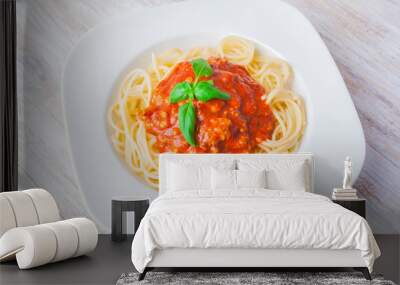 spaghetti bolognese in white bowl on wooden table Wall mural