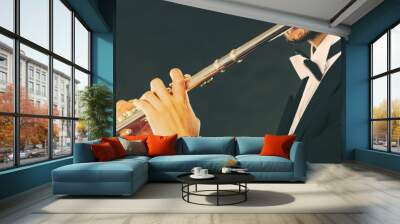 Elegantly dressed male musician playing flute Wall mural