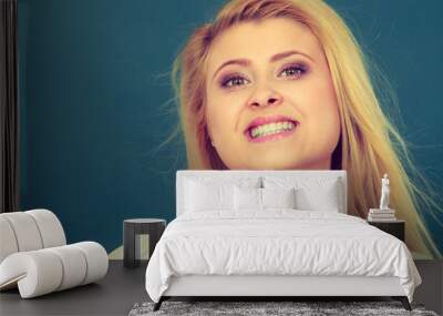 Happy positive smiling blonde woman Wall mural