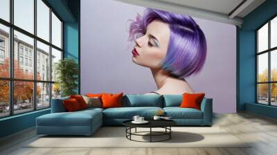 Portrait of a woman with bright colored flying hair, all shades of purple. Hair coloring, beautiful lips and makeup. Hair fluttering in the wind. Sexy girl with short  hair. Professional coloring Wall mural