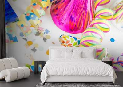 streamers, confetti, funny hats and party horns Wall mural