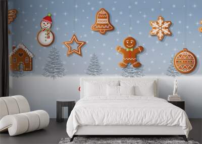 Merry christmas background with gingerbread cookies on snowy landscape background Wall mural