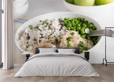 Chicken fricassee with basmati rice and wild rice. Served with buttered green peas on a plate Wall mural