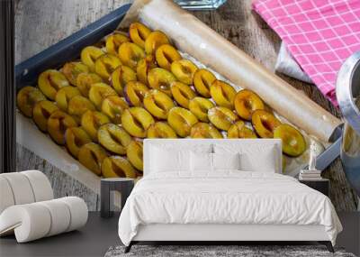 Raw plum cake on a baking sheet Wall mural