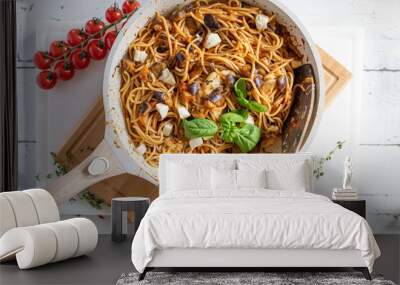 Spaghetti with eggplant tomato sauce in a frying pan Wall mural