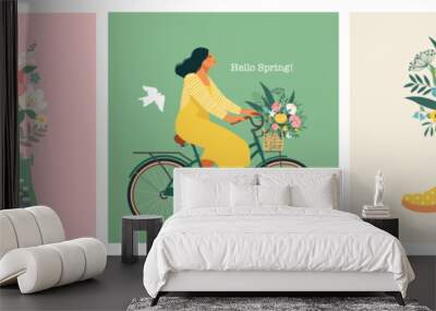 A typewriter with the text of congratulations, a girl riding a bicycle, a bouquet in a rubber boot and a garden watering can. Wall mural