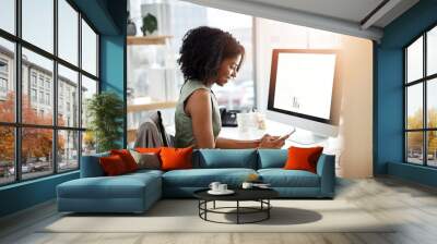 Black woman, smartphone and office smile at desk for social media, communication and typing text. Female business person at computer screen, contact and notification with meme, internet and app Wall mural