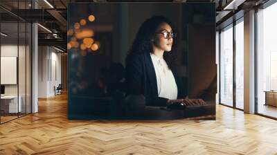 Office, business and black woman on computer for research, project management and online at night. Corporate manager, vision and female worker working late on strategy, planning and reading website Wall mural