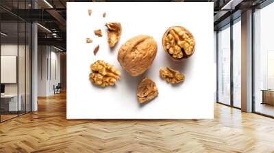 a whole walnut and an open walnut on a white table, top view
 Wall mural