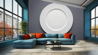 empty white plate from above on grey background
 Wall mural