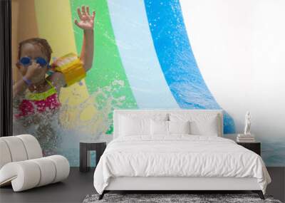 A girl playing in a summer swimming pool Wall mural