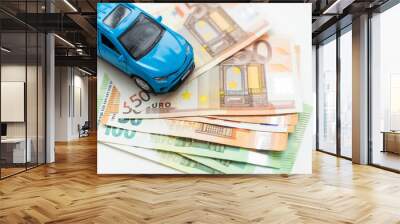 Car and money concept - toy automobile with euro money. Wall mural