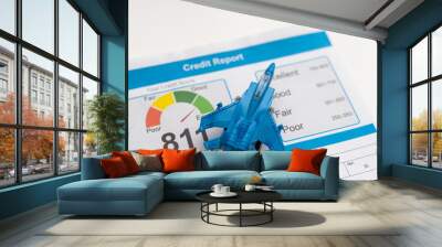 Credit score report document and toy plane on desk. Wall mural