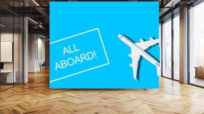 Flat lay design of travel concept with plane on blue background with copy space Wall mural