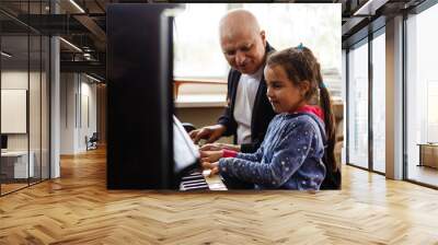 grandfather teach girl playing the piano happily Wall mural