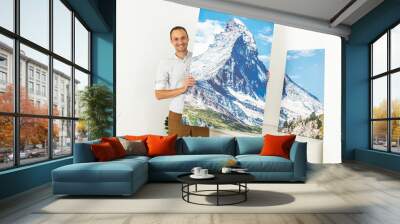 Photo printed on canvas. A man holds in his hands a landscape mountains photography Wall mural