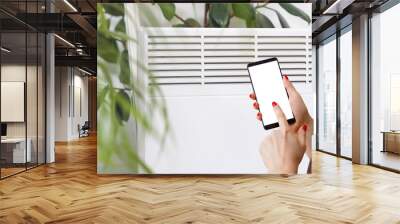 Smart heater convector control by phone app. Smart Home with the smart heating system. Electric panel heating concept. Wall mural