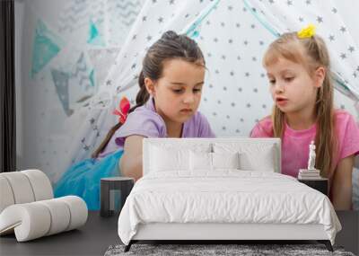 two little girls eating strawberries Wall mural